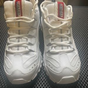 Sketchers sneakers. White gym shoes, and trendy.